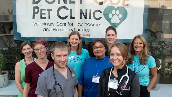 The Doney Coe Pet Clinic staff outside the front of their building.