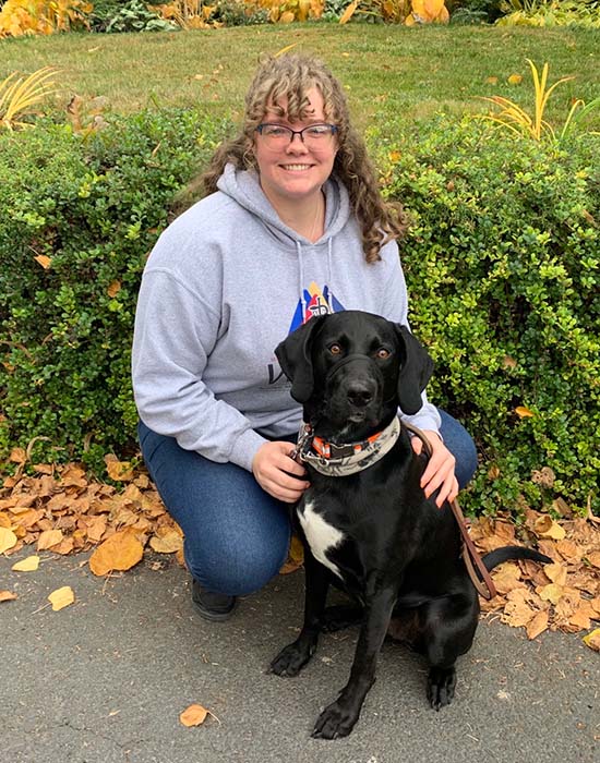 Sydney and her black lab.