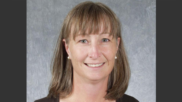 Dr. Sellon outside the College.