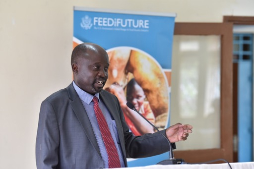 Christopher Wanga speaking at the microphone.