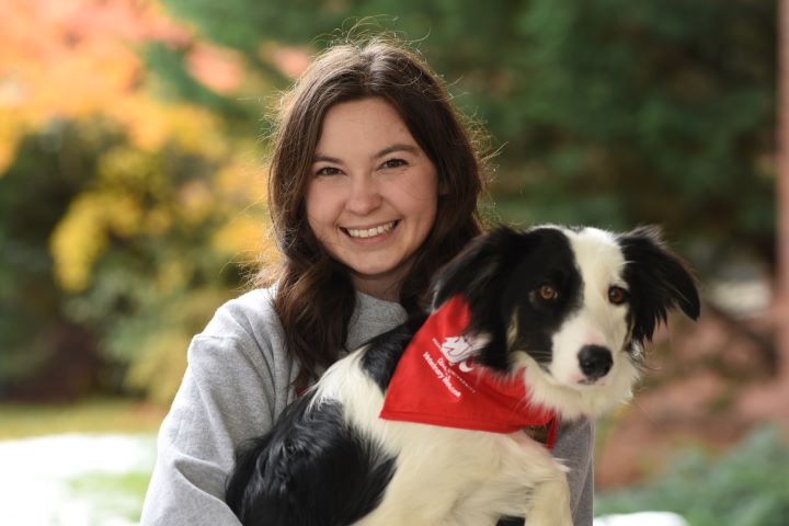 Delany Clem holds her dog, Posy