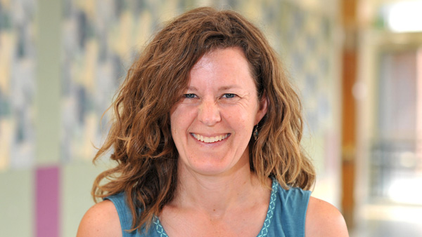 Dr. Cary in a lobby at the college.