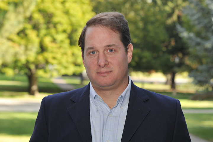 Dr. Villarino standing outside Bustad Hall on the WSU Pullman campus.