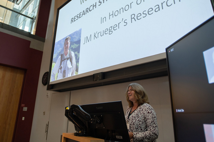 Dean Dori Borjesson at the podium giving an introduction to the event.