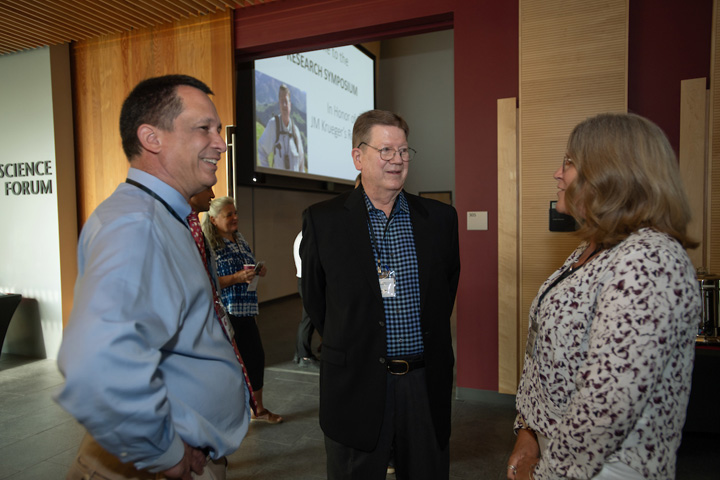 (L-R) Hans Van Dongen, James Krueger, and Dori Borjesson in a friendly discussion before the symposium begins.