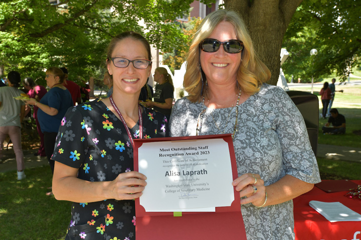 Alisa Laprath receiving her award from Dean Dori Borjesson.