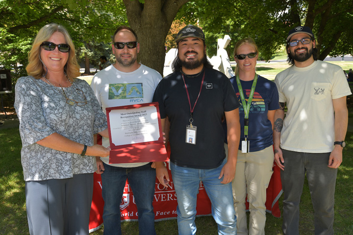 WADDL aquatics team receiving her award from Dean Dori Borjesson.