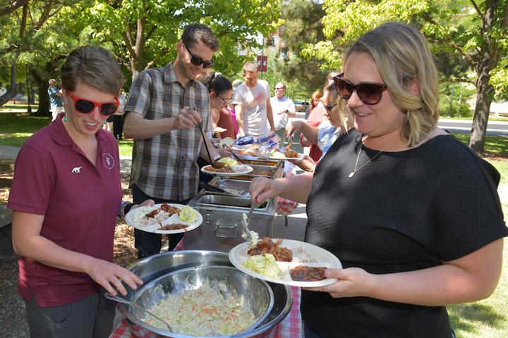 Faculty and staff going through the food line.