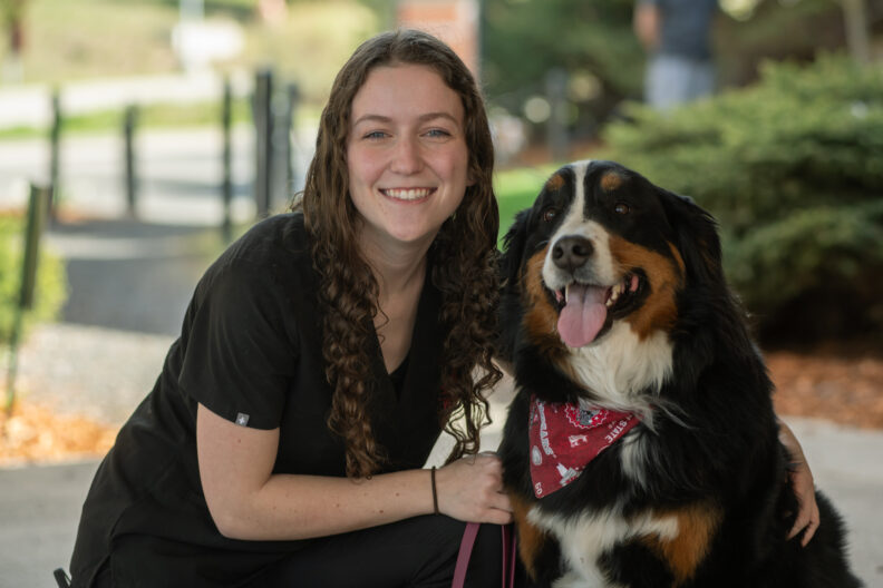 Chloe Hoover, an ambassador for the College of Veterinary Medicine at Washington State University, poses for a photo with her dog Remy on Tuesday, May 2, 2023, in Pullman. (College of Veterinary Medicine/Ted S. Warren)