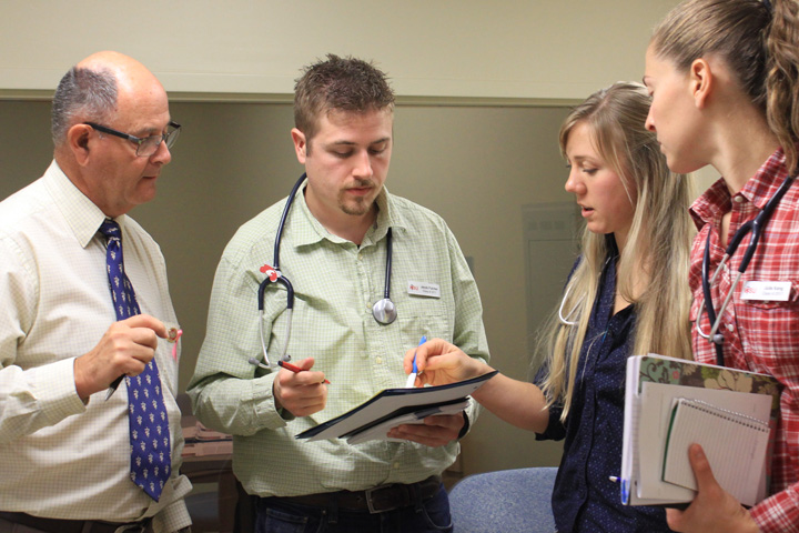 (left) Veterinary facilitator, Dr. Mike Burdette, with Diagnostic Challenge students.