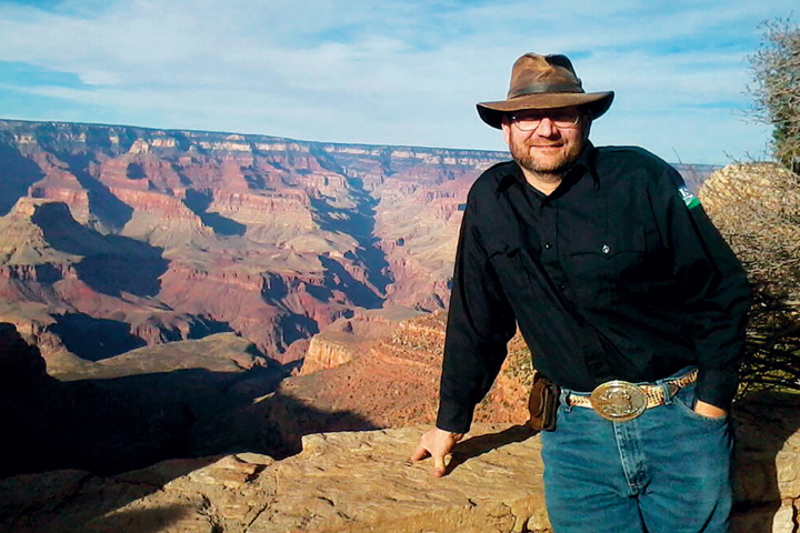 Dr. Bender posing with the Grand Canyon in the background.