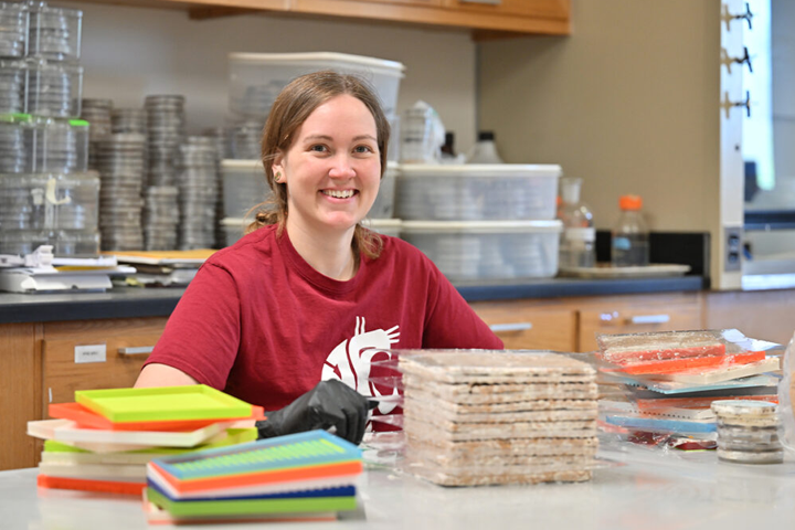 Katy Ayers at a work area in a lab.
