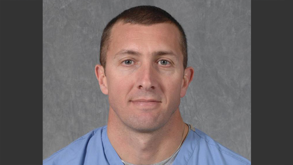 Professional headshot of Dr. Martin Suarez in a photo studio.