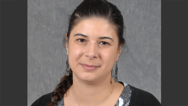 Professional headshot of Laura.