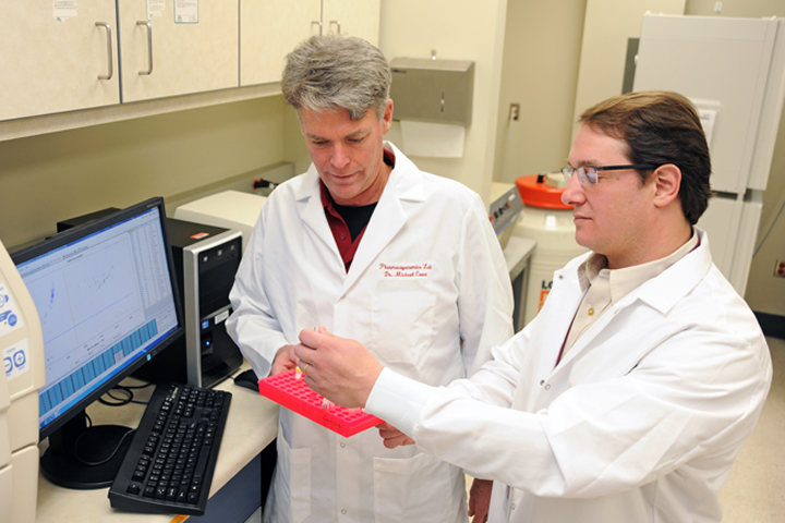 Michael Court and Nicolas Villarino in the lab.