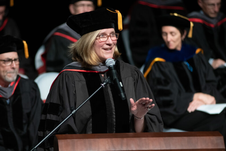 Dean Dori Borjesson at the podium during the 2023 College of Veterinary Medicine commencement ceremony.