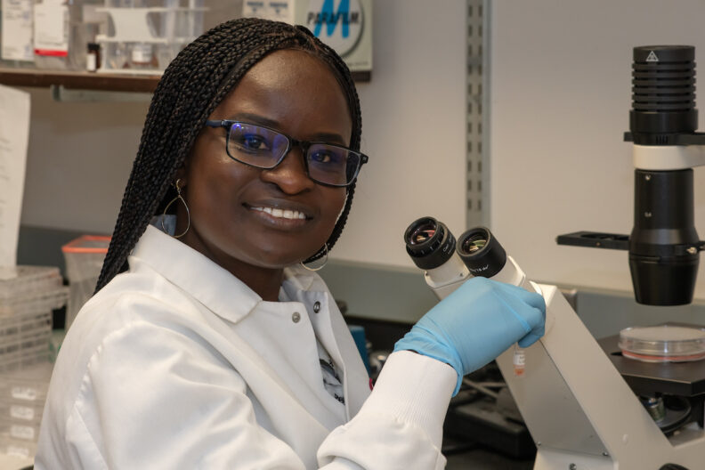 Albina Makio holds a vial of herpes simplex virus that she uses in her research on Monday, Nov. 13, 2023, as she poses for a photo in her lab at Washington State University's College of Veterinary Medicine in Pullman.