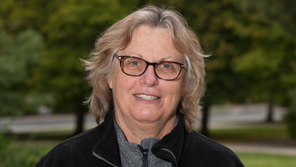 Dr. Talcott outside the College.