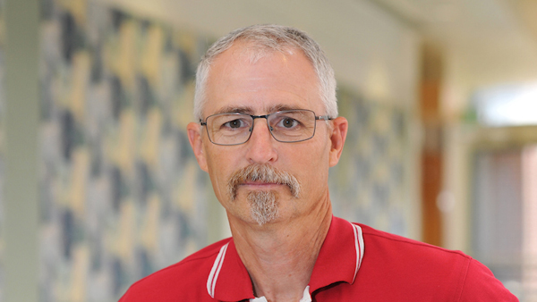 Kelly Farnsworth in a hallway at the college.