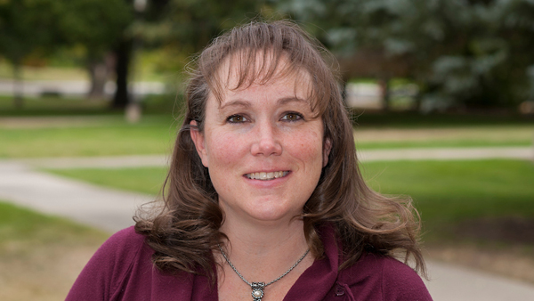 Rachel Halsey standing outside the College of Veterinary Medicine.
