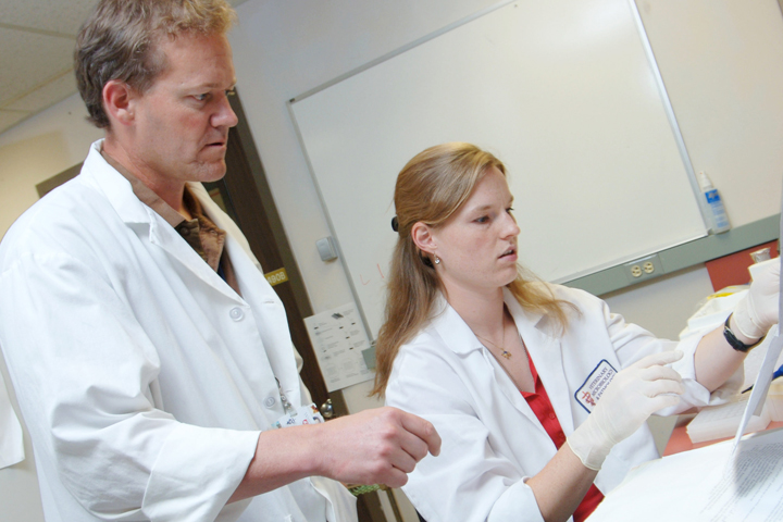 Dr. Doug Call working with a student in his lab.