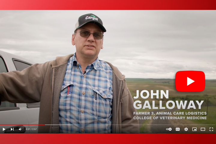 Screen grab from YouTube video. John Galloway is standing next to his "office" - his truck.