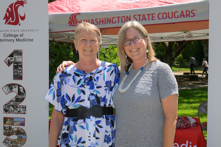 Kathleen standing with Dean Dori.