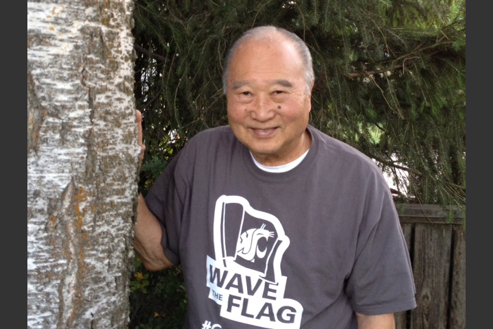 Dr. Nakata standing next to a tree.