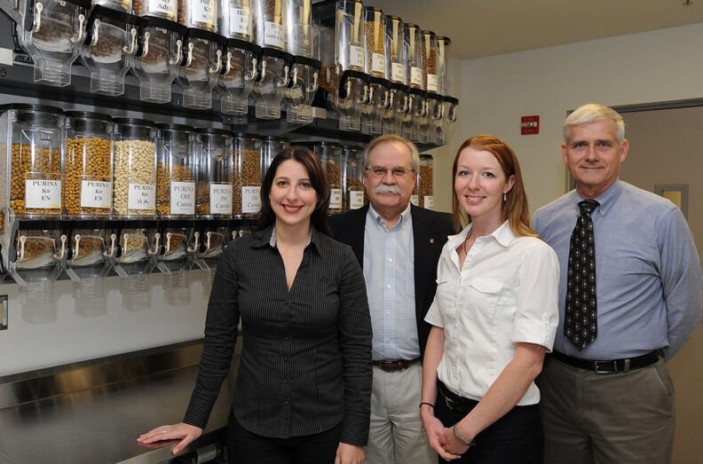 (l-r) Emily Cross, Purina Senior Veterinary Communications Manager; Bryan Slinker, dean of the college; Ainsley Bone (’11 DVM); Harmon Rogers, former director of the Veterinary Teaching Hospital.