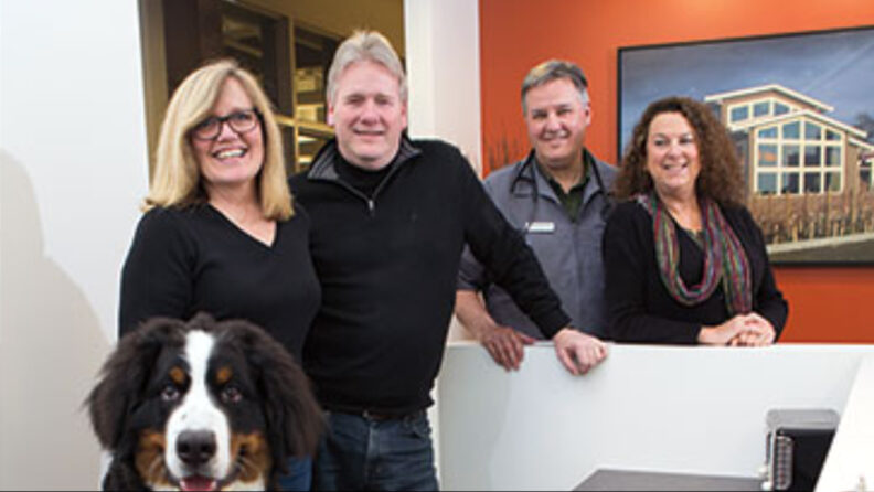 L-R. Lew, Alma, Michael and one other person in the lobby of the vet clinic.