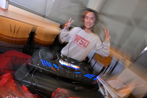 DVM student DJing a the 125 party. A swirl effect has been put on the image.
