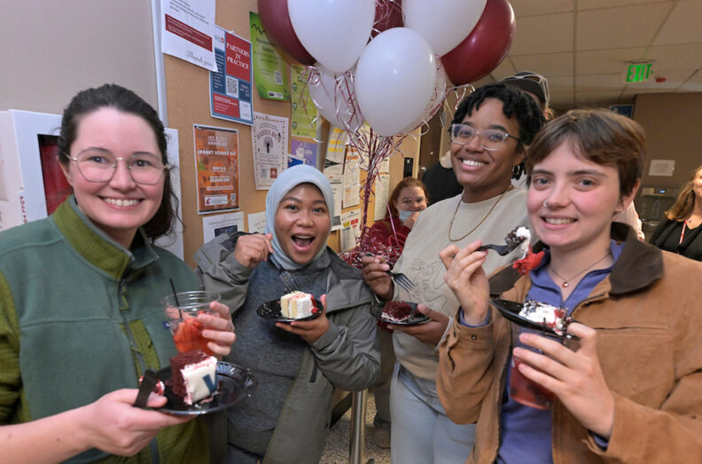 Group poses for a candid shot in the hallway after they got their cake.