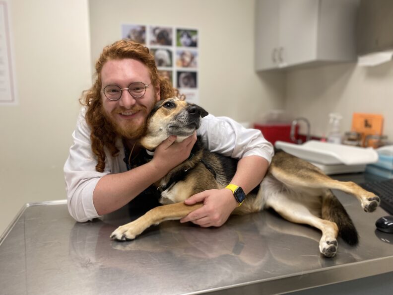 Jacob Fillman with a dog.