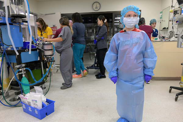 Maddie Hedrick wears surgical scrubs.