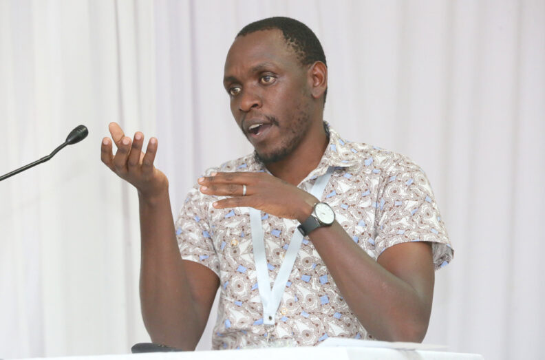 Dr. Ngetich speaking into a microphone.