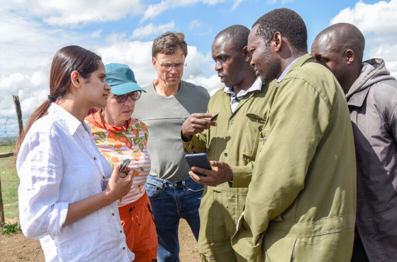 Five people surrounding Dr. Ngetich.