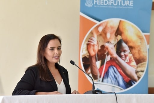 Meera Chandra at a podium.