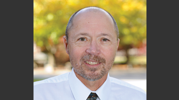 Steve Hines outside on a bright summer day.