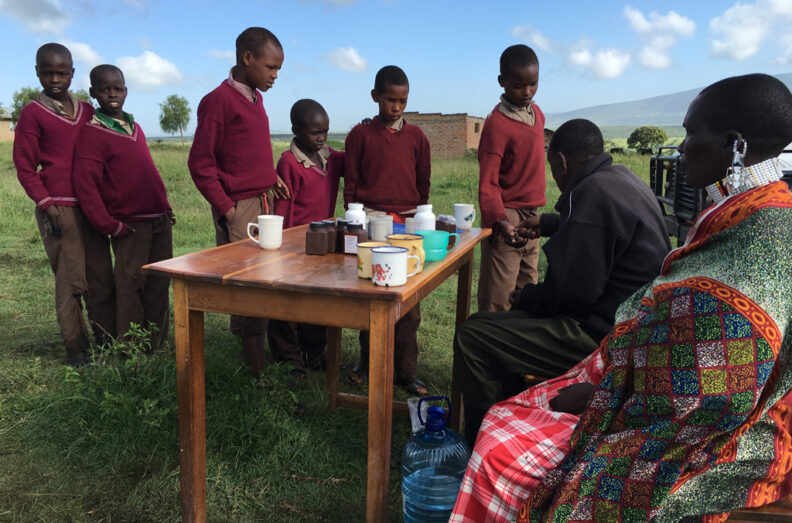 Tanzanian children lined up for deworming medication.