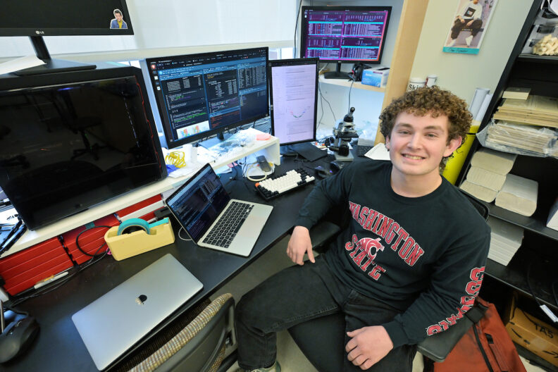 Mason Matich works at a computer.