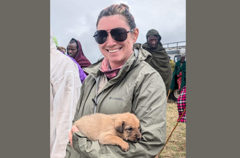 Jessi Steere holding a puppy.