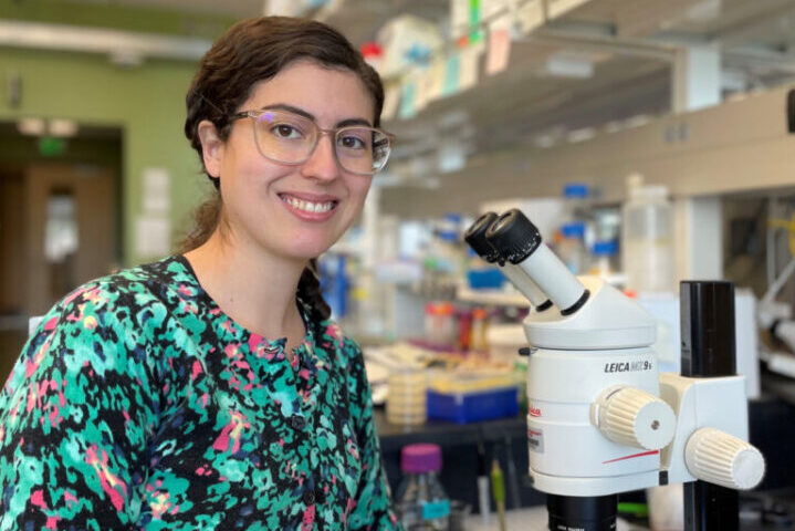 Eliza Merlin poses in a lab.