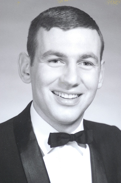 Arthur Crates black and white graduation photo. He's wearing a black and white suit with a bow tie.