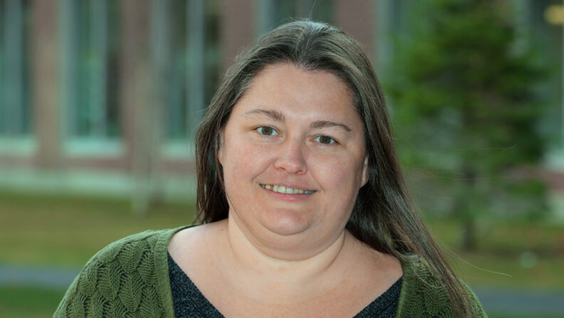 Chanelle, outside the building she works in.