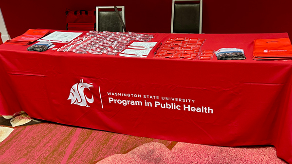 Table set up with merchandise and information pieces to give away.