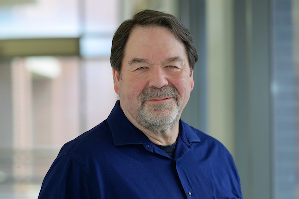 Professional headshot of Doug.