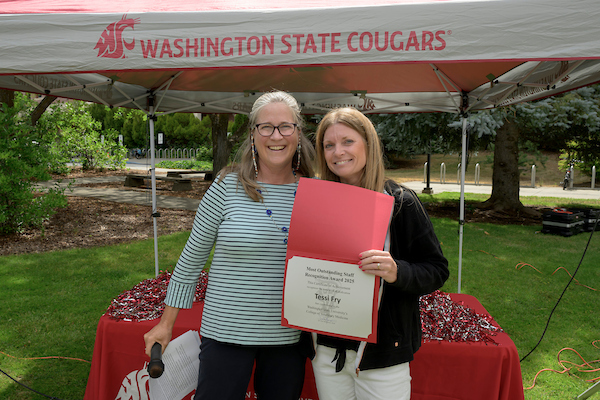 Tessi receiving her award from Dean Dor.