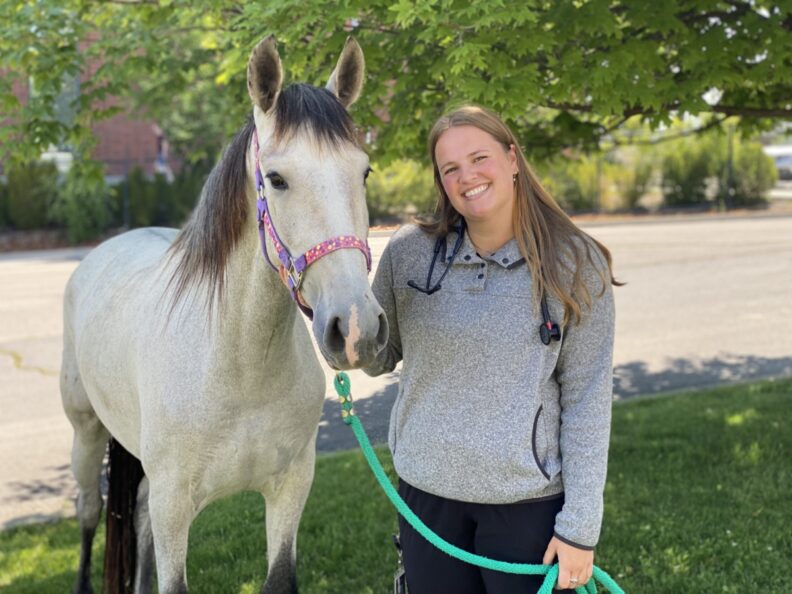 Abby Hayden poses with a horse.