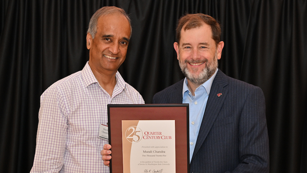 Dr. Chandra receiving his certificate from System Provost and Executive Vice President T. Chris Riley-Tillman.
