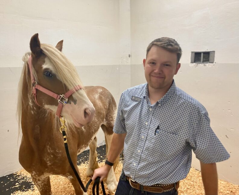 Hayden Erickson with a horse.